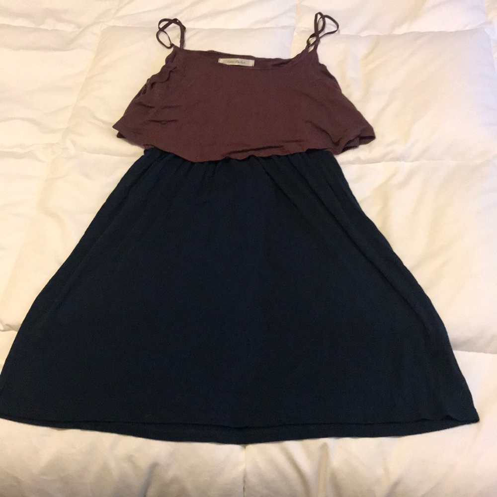 Thin strap, navy and tan dress with ruffle top.
